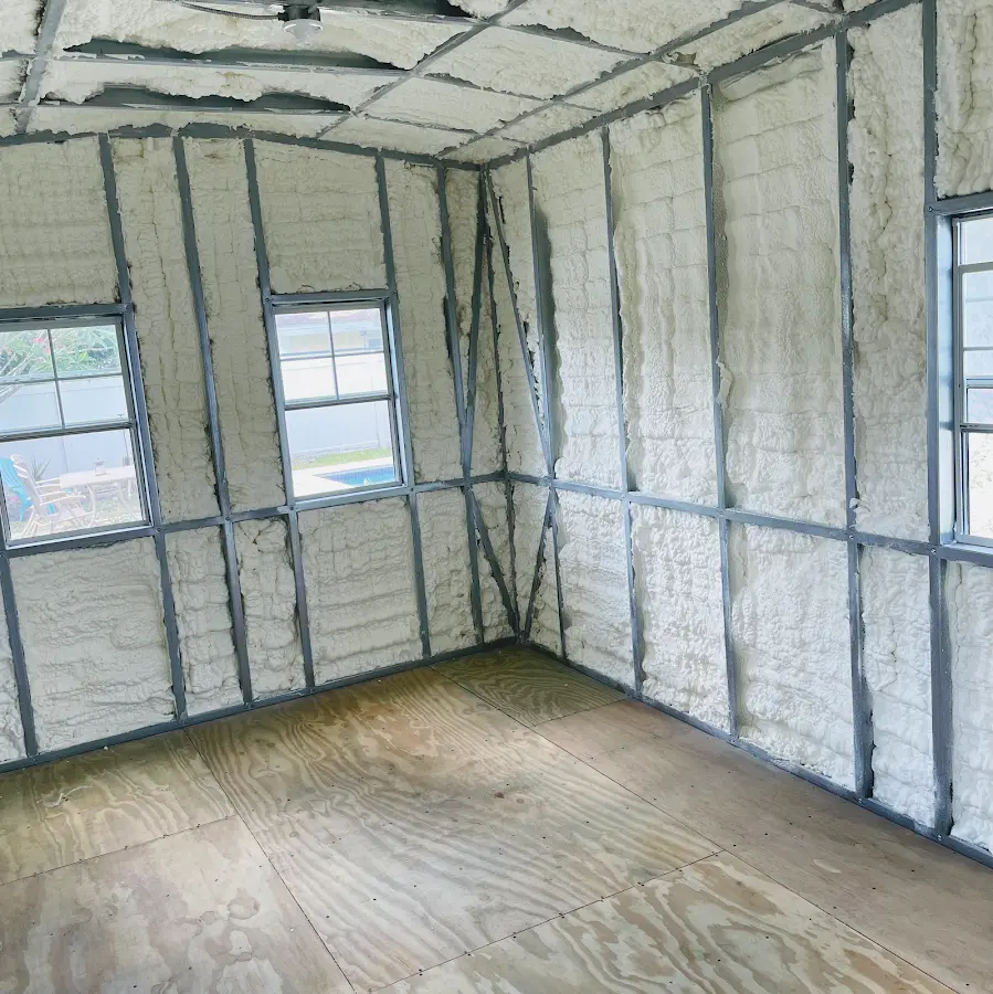 Closed-cell spray foam insulation applied to wall cavities in a residential project in Kingsford